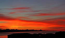 Plettenberg Bay sunrise with Tsitsikamma Mountain in the background.